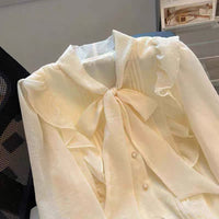 Side ruffle tie neck blouse