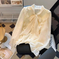 Side ruffle tie neck blouse