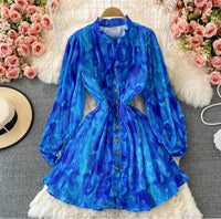 Peasant sleeve button through tie neck pleated dress