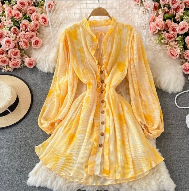 Peasant sleeve button through tie neck pleated dress