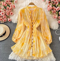 Peasant sleeve button through tie neck pleated dress