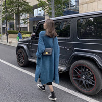 Knitted cardigan with buckets in Blue