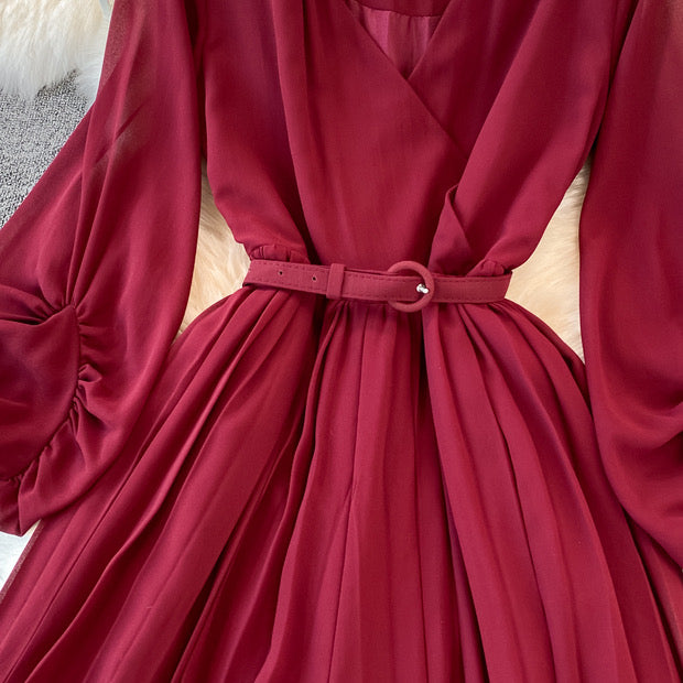 Long lantern sleeve wrap pleated jumpsuit with matching color belt