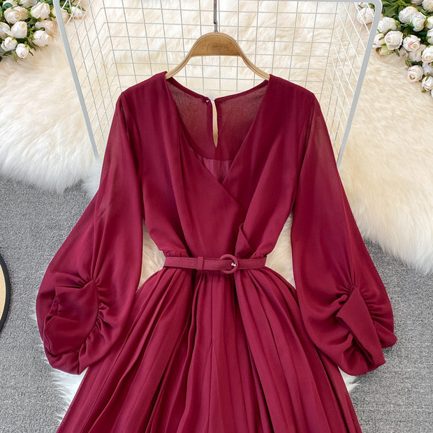 Long lantern sleeve wrap pleated jumpsuit with matching color belt