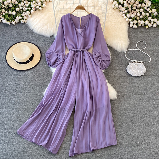 Long lantern sleeve wrap pleated jumpsuit with matching color belt