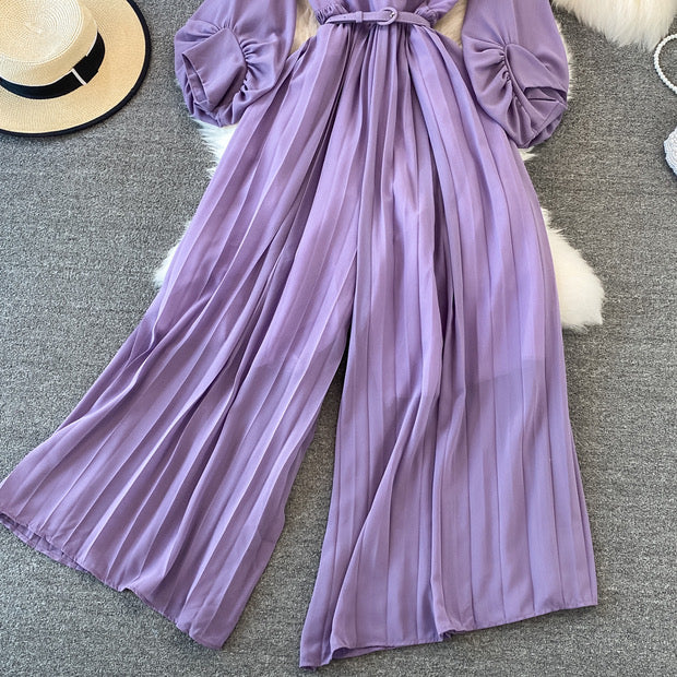 Long lantern sleeve wrap pleated jumpsuit with matching color belt