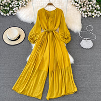 Long lantern sleeve wrap pleated jumpsuit with matching color belt