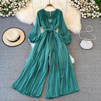 Long lantern sleeve wrap pleated jumpsuit with matching color belt