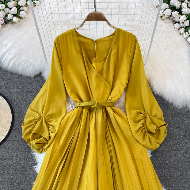 Long lantern sleeve wrap pleated jumpsuit with matching color belt