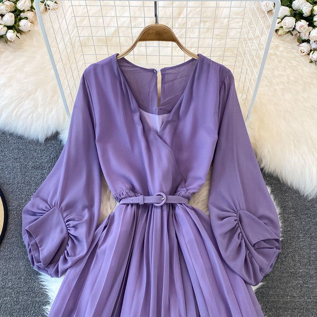 Long lantern sleeve wrap pleated jumpsuit with matching color belt