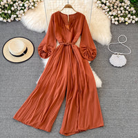 Long lantern sleeve wrap pleated jumpsuit with matching color belt