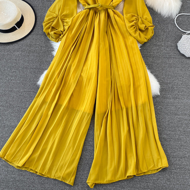 Long lantern sleeve wrap pleated jumpsuit with matching color belt